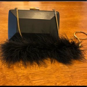 Small black clutch with boa accent